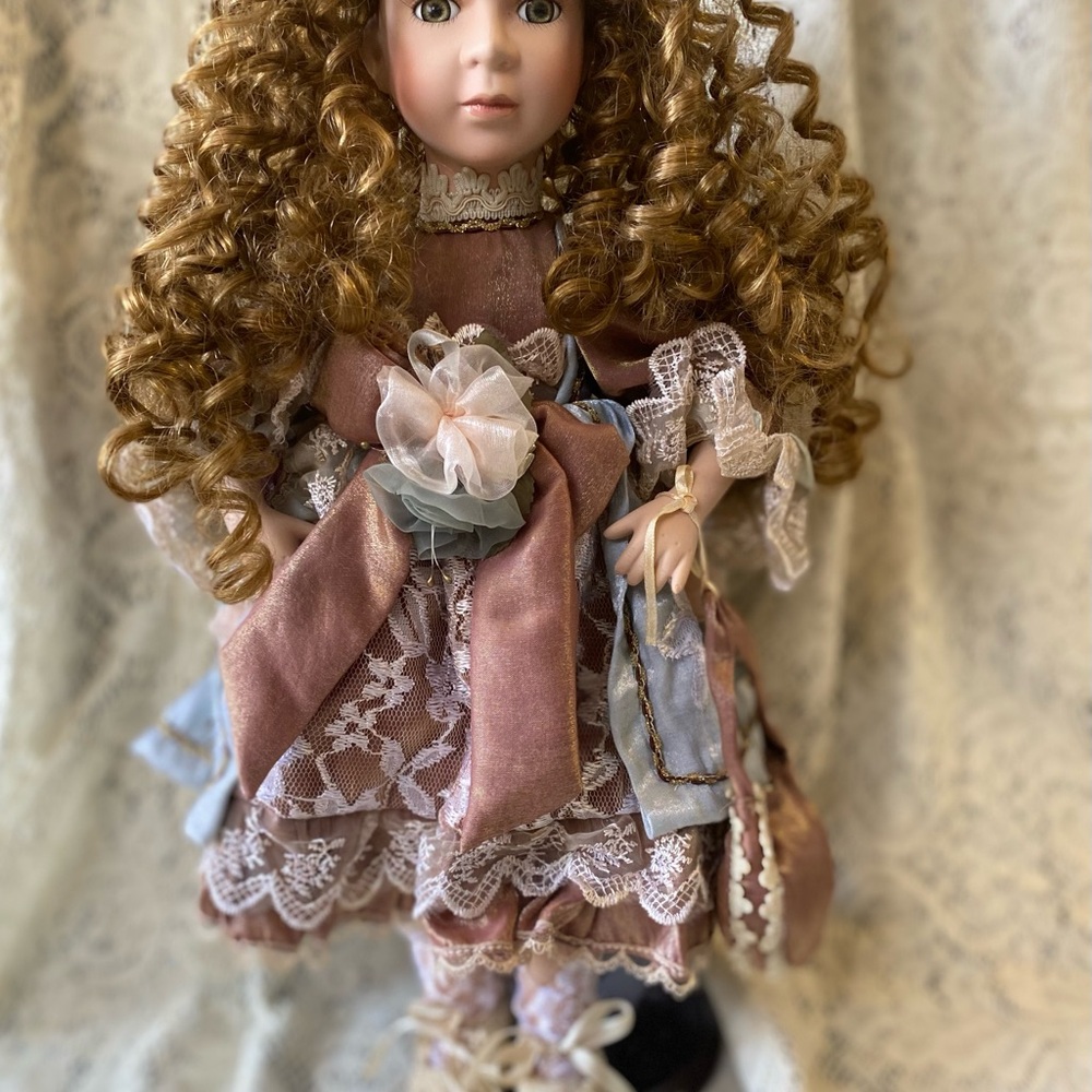 Elegant Porcelain Doll with Curly Hair